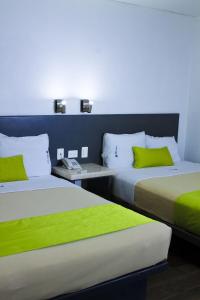 Postel nebo postele na pokoji v ubytování Global Express Hotel Escarcega + 14 fotografií