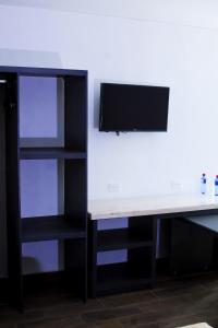 TV a/nebo společenská místnost v ubytování Global Express Hotel Escarcega