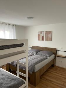 a bedroom with two bunk beds in it at Casa Estella in Rust