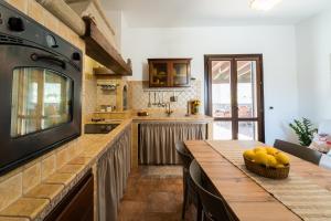 Kuchyň nebo kuchyňský kout v ubytování I Colori del Tufo