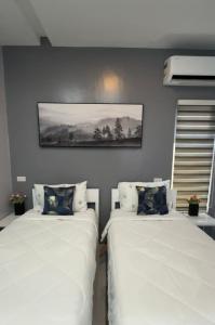 เตียงในห้องที่ Anavada Apartment - Davao City