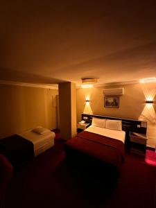 Postel nebo postele na pokoji v ubytování Minabir Otel