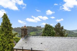 a roof of a house with a castle in the background at 44 Wellington Street in Matlock