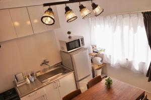 Cucina o angolo cottura di Lino下伊福 岡山駅車で5分 無料駐車場 レストラン徒歩圏内多数