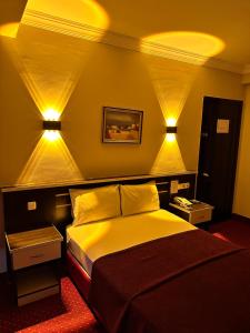 Postel nebo postele na pokoji v ubytování Minabir Otel