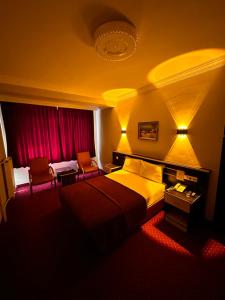 Postel nebo postele na pokoji v ubytování Minabir Otel