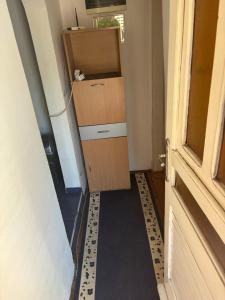a room with a door and a box at Miky Apartments in Podgorica