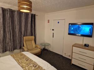 TV a/nebo společenská místnost v ubytování Steyn Guest Lodge