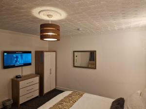 Postel nebo postele na pokoji v ubytování Steyn Guest Lodge
