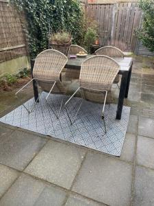 a table with two chairs and a table with at Next To Sea in Vlissingen