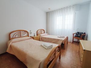 Postel nebo postele na pokoji v ubytování Apto. Eva - Laxe - Costa da Morte