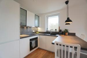Kuchyň nebo kuchyňský kout v ubytování Südstrand Apartment