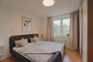 Postel nebo postele na pokoji v ubytování Südstrand Apartment