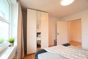 Postel nebo postele na pokoji v ubytování Südstrand Apartment