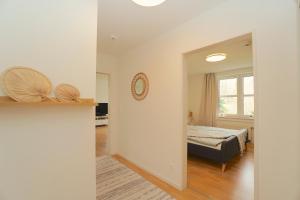 Postel nebo postele na pokoji v ubytování Südstrand Apartment