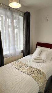 Postel nebo postele na pokoji v ubytování Steyn Guest Lodge