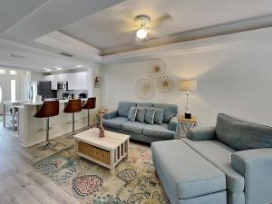 a living room with a couch and a table at Palm Coast Hideaway in Palm Coast