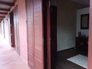 an empty hallway with wooden doors in a room at Casa Azul in Mindelo
