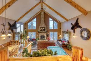 a living room with a pool table in it at Rocky Ridge Lodge in Lead