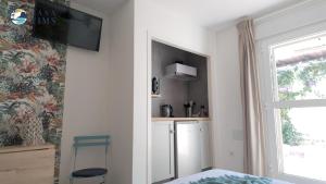 TV a/nebo společenská místnost v ubytování CasaTIMS - Adults Only