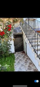 a stairway leading to a door with a stair railing at Sıcak Cermik Termal Havuzlu Family Villa 1 in Sivas