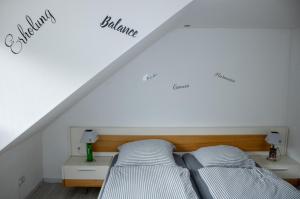 a bedroom with two beds in a attic at Ferienwohnung 1 in Wilhelmsfeld