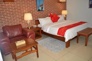 Postel nebo postele na pokoji v ubytování Grand Hôtel Aéroport, Douala