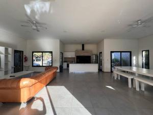 a large living room with a couch and tables at Departamento Amoblado de lujo! in Pilar