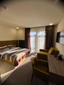 Postel nebo postele na pokoji v ubytování Гетьман Готель & SPA
