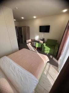 Ένα ή περισσότερα κρεβάτια σε δωμάτιο στο Гетьман Готель & SPA