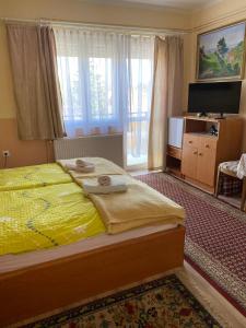 Postel nebo postele na pokoji v ubytování Károly Vendégház + 25 fotografií