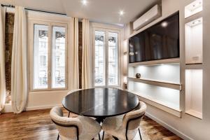 a dining room with a table and two chairs at Les Jacobins, hypercentre in Lyon
