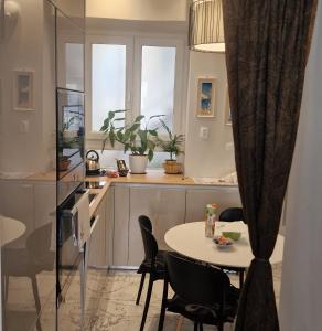 a kitchen with a table and chairs in a room at Old Town Apartment in Omiš