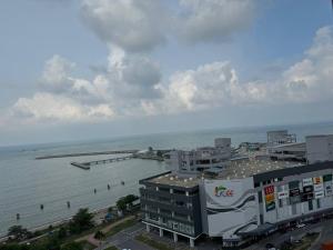 a building next to a body of water at D'CIELLA Homes- Sea View, Drawbridge & KTCC Mall in Kuala Terengganu