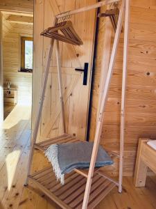 a ladder in a wooden room with a door at Babiogórskie klimaty in Zawoja