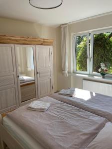 Postel nebo postele na pokoji v ubytování Haus-Seeschwalbe