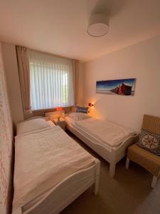 Postel nebo postele na pokoji v ubytování Haus-Seeschwalbe
