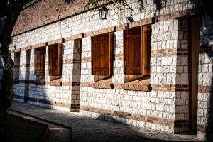a brick building with wooden windows on it at Fortino Napoleonico in Ancona +87 photos
