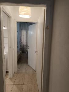 a hallway with a hallway leading to a bathroom at AL183 in Cagliari