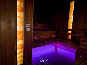 a room with a purple light in the floor at Hotel Szent István in Eger