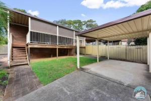 a house with a garage and a fence at Aircabin - Marayong - Convenient - 3 Beds House in Blacktown