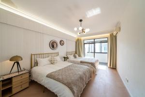 Voodi või voodid majutusasutuse Shanghai Downtown Yi Du B&B - Near Jing'an Temple Subway 200 meters and shopping mall toas