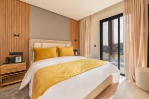 Un ou plusieurs lits dans un hébergement de l'établissement Appart Hôtel Rambla