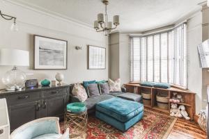 a living room with a couch and a chair at Helter Skelter Matlock in Matlock