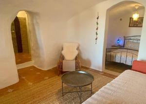 A bed or beds in a room at Cueva Romana Cave House, Clothing Optional, Adult Only