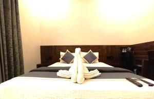 Postel nebo postele na pokoji v ubytování HOTEL ELITE