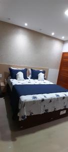 מיטה או מיטות בחדר ב-POUSADA TIO LUIZ