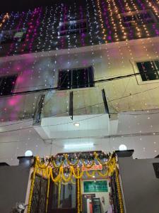 a view of a building with lights on the ceiling at Hotel New Ashiyana Palace Inn Varanasi in Varanasi