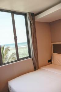 Postel nebo postele na pokoji v ubytování Starry Beach Inn