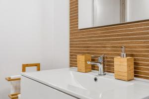 a bathroom with a sink and a mirror at New 2024 Urban 48 in Cagliari